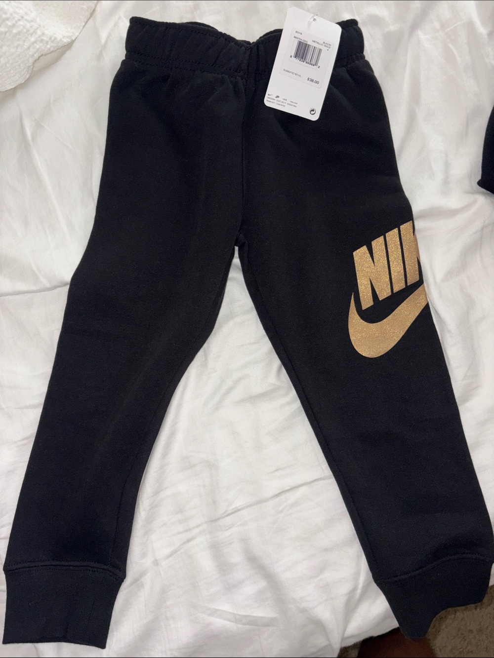 Nike Kids Black Joggers with Metallic Gold Logo